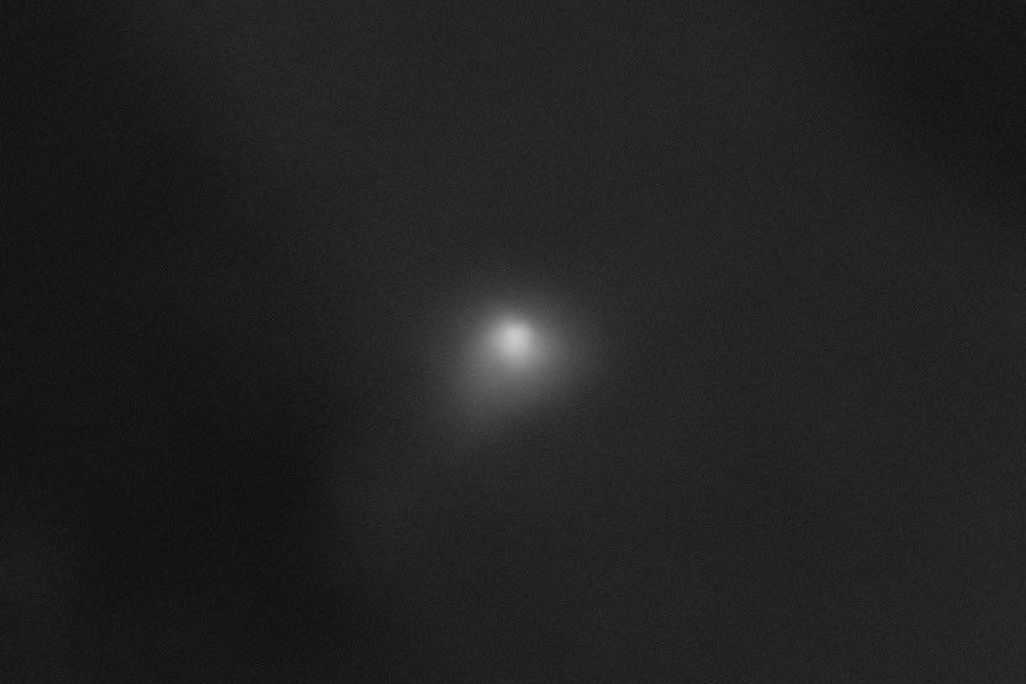 image of comet with a faint glow around it