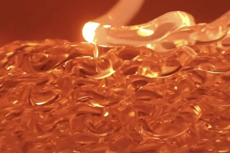 Molted glass during the 3D printing process, screenshot from "Glass" on Vimeo
