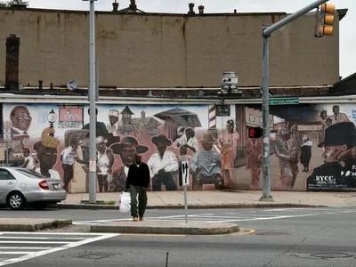 The "Faces of Dudley" mural depicts residents of Boston's Roxbury neighborhood