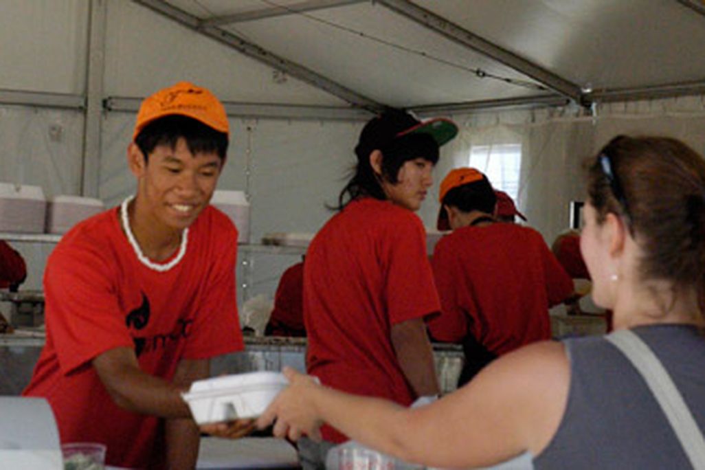 A visitor samples southeast Asian food at the 2011 Smithsonian Folklife Festival
