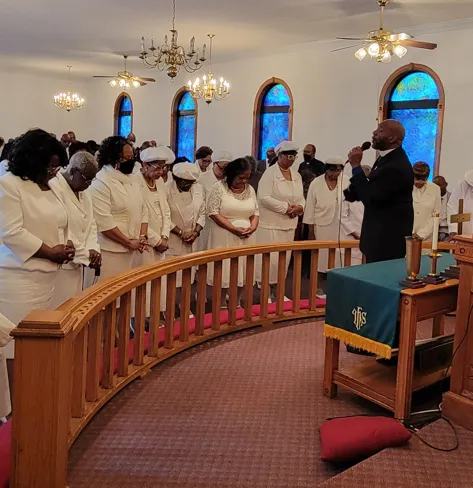 Deaconesses worshipping in white thumbnail