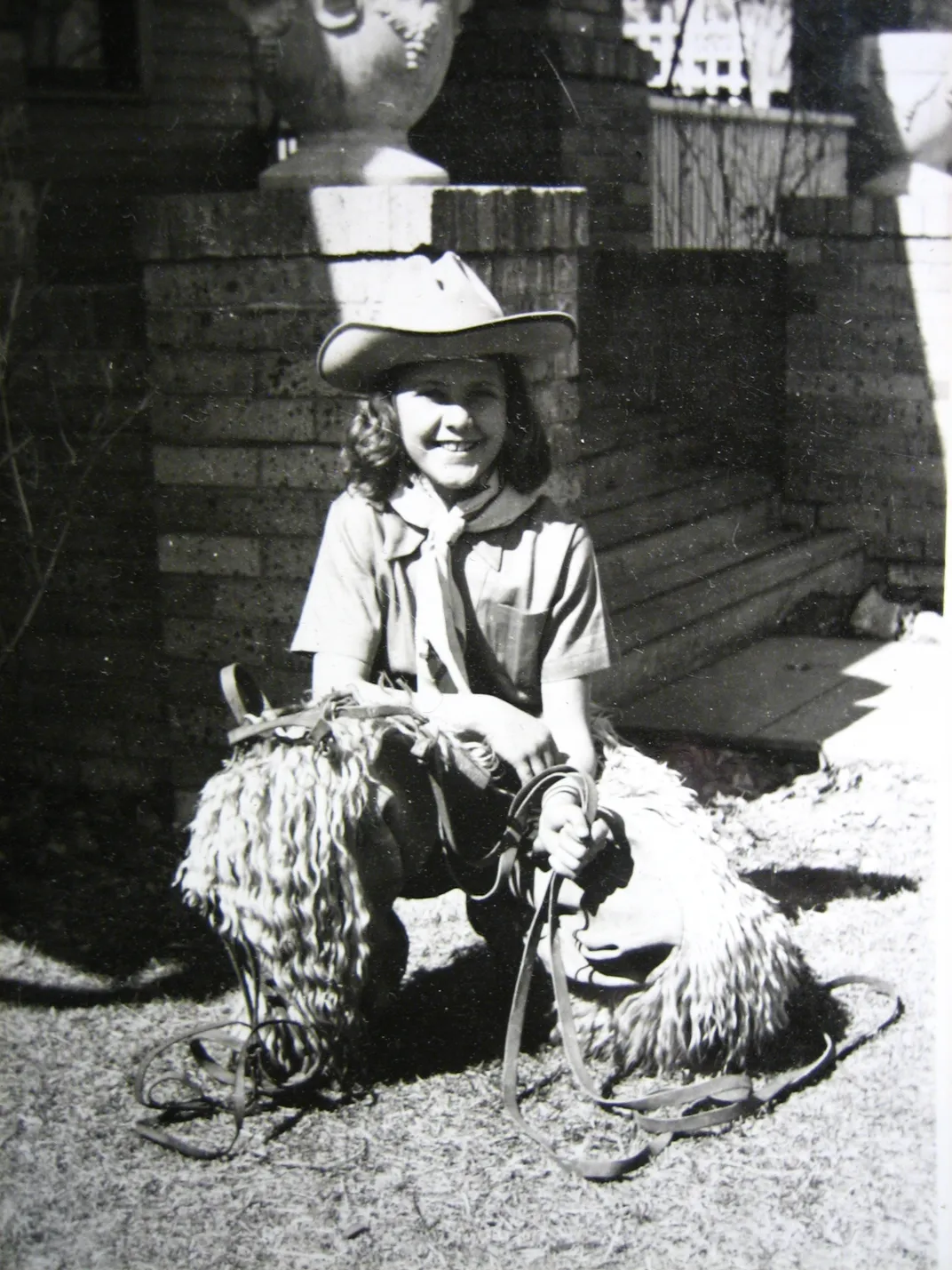 Young girl dressed as a cowgirl in black and white