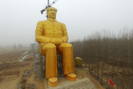 A gold-painted statue of Chairman Mao has been erected in a remote part of central China. 