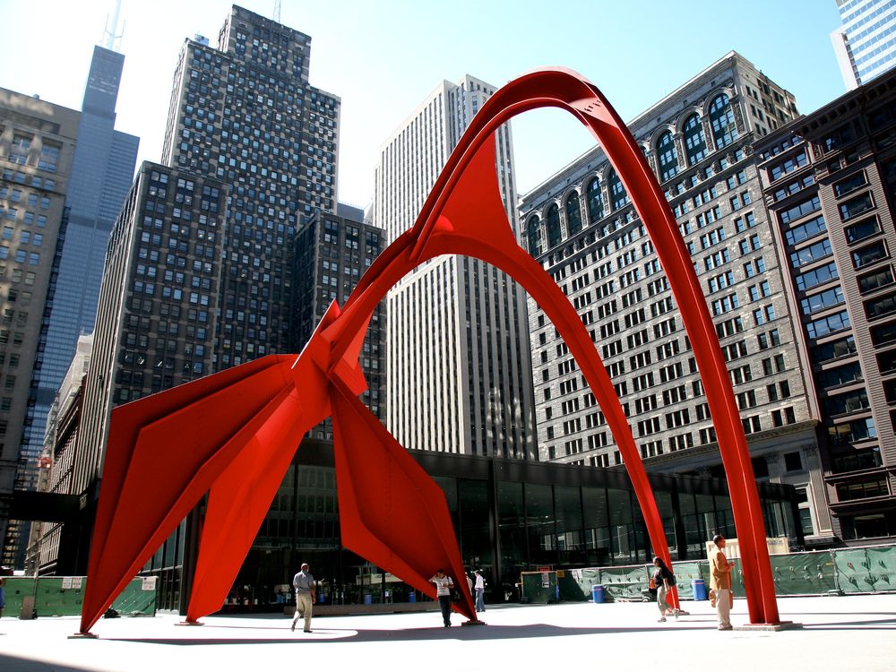 abstract red sculpture in city square