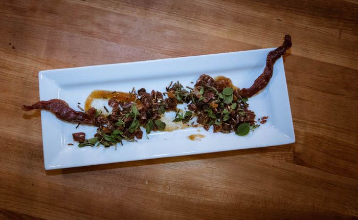 Crispy duck on a white plate