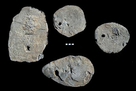 Four lead ingots found in a shipwreck off the coast of Israel feature Cypro-Minoan markings but actually originated in Sardinia.