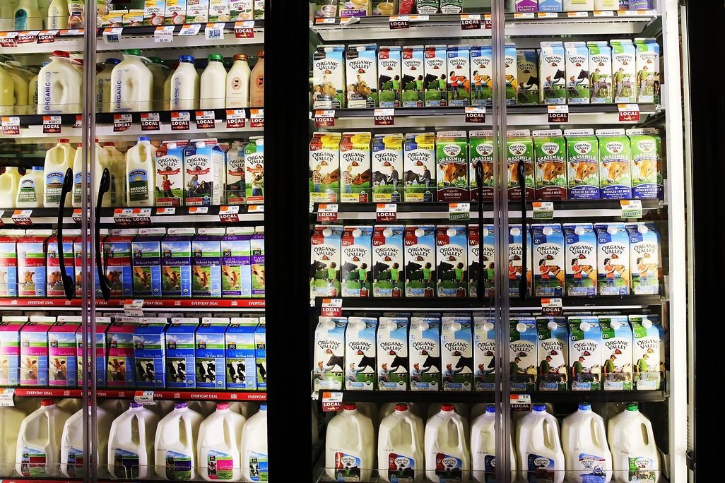 A refrigerator of milk in a grocery store