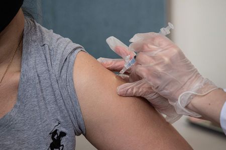 After receiving a Covid-19 vaccine, many patients experience side effects, like arm soreness, headache and fever.