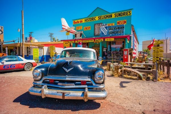 A old car in front of a cafe on historic Route 66 thumbnail