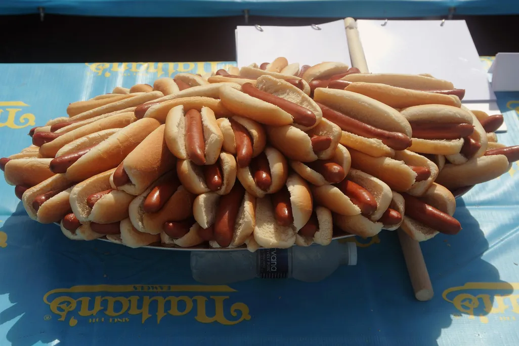 A massive platter of hot dogs in buns