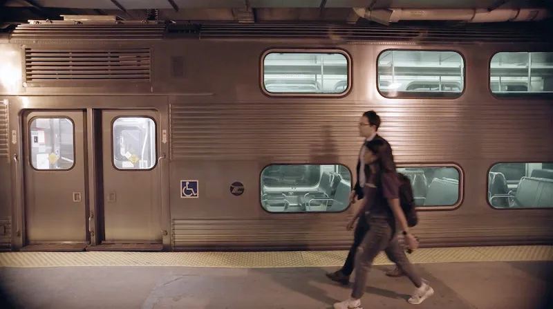 two people in front of a subway
