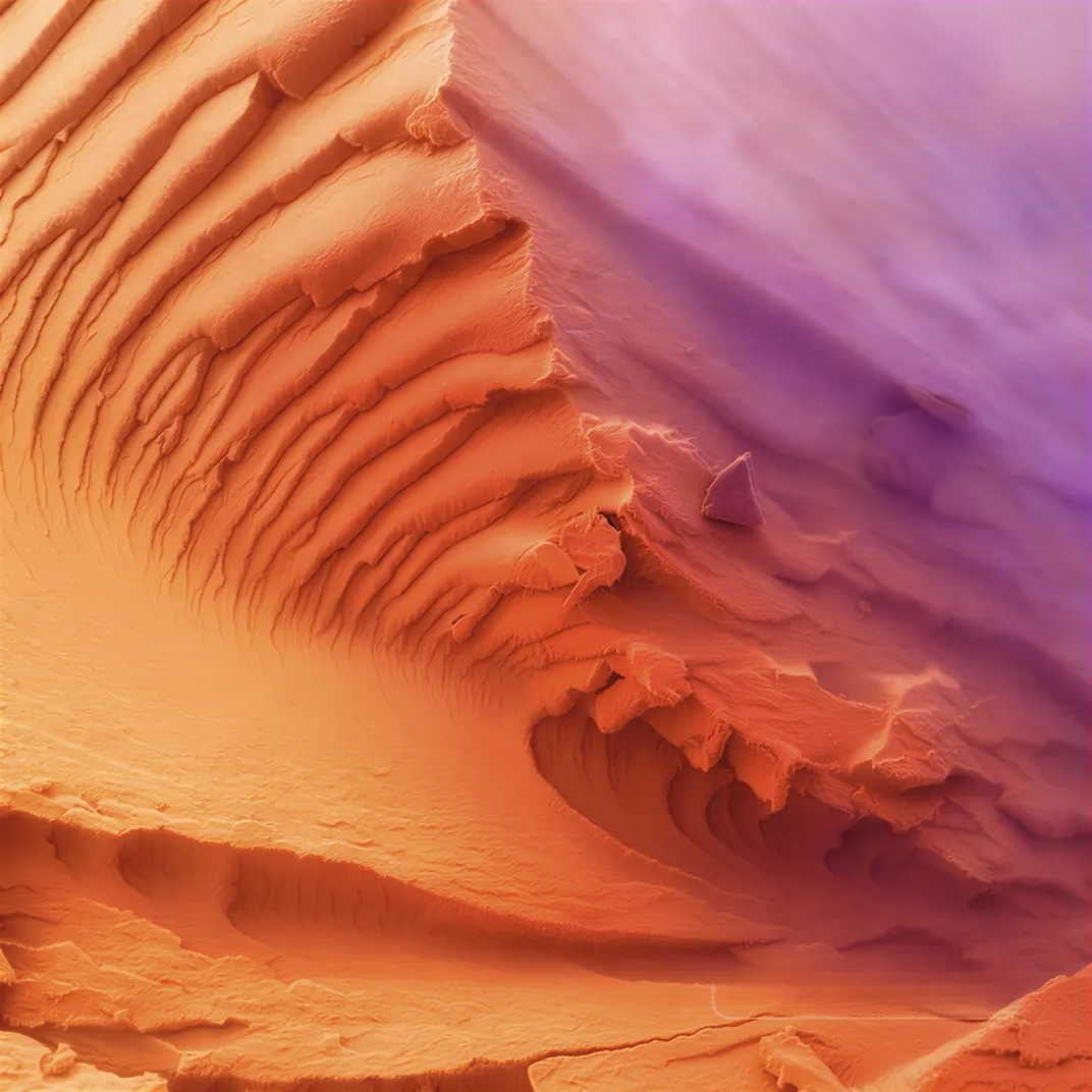 orange and pink material that looks to be a desert landscape from above