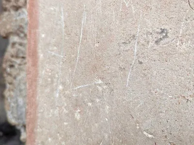 &nbsp;A Kazakh tourist etched the letters &quot;ALI&quot; into a wall at Pompeii&#39;s House of Ceii.