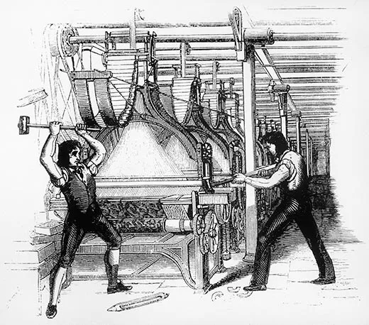 The luddites were threatened by industrialization of what industry in particular?