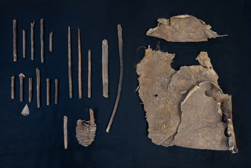 The artifacts recovered from the cave against a black background.
