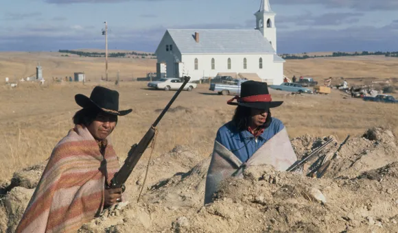 Two Natives waiting for the fire fight
