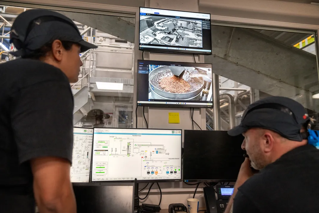At Innovafeed in France, production director Chaimaa Hazm, left, and line operator Kevin Freitas monitor the larvae harvest.