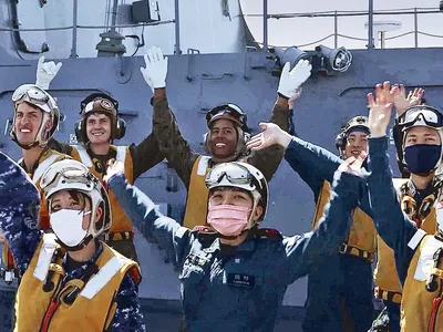 The mood was celebratory aboard the Japanese ship Izumo last October when U.S. Marines landed and took off again. After the cross-deck exercise, Japanese sailors and airmen cheered along with U.S. Marines of Fighter Squadron 242.