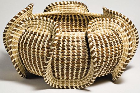 African slaves brought their art of basket weaving to the American South.  See samples such as this wave basket through November 28 at African Art.
