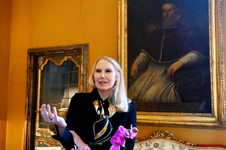 This photograph taken on January 21, 2022, shows the Princess Rita Boncompagni Ludovisi in front of a painting of Pope Gregorio XV at the Casino dell'Aurora inside the Villa Boncompagni Ludovisi in Rome.
