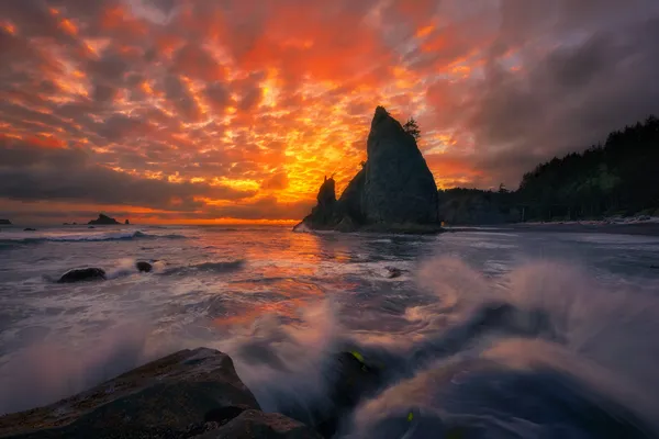 A fiery sunset rages at rugged Rialto Beach, Washington, USA thumbnail