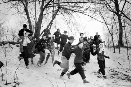 "Young people run down a snowy hill with enthusiasm, ca. 1940" in Chicago