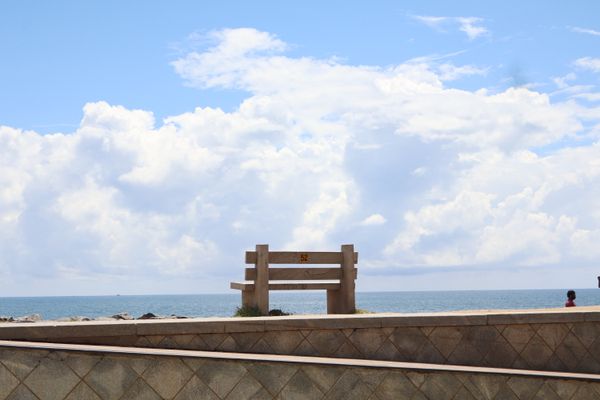 A lonely bench on a seaside thumbnail