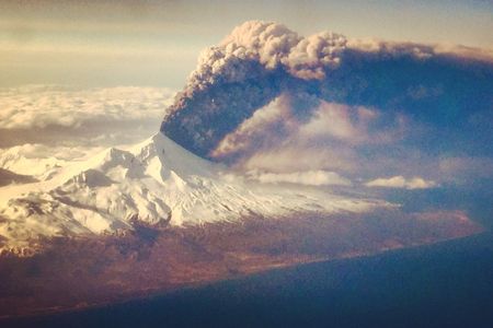 A passenger aboard a commercial flight to Anchorage, AK snapped this picture of the volcano in action.