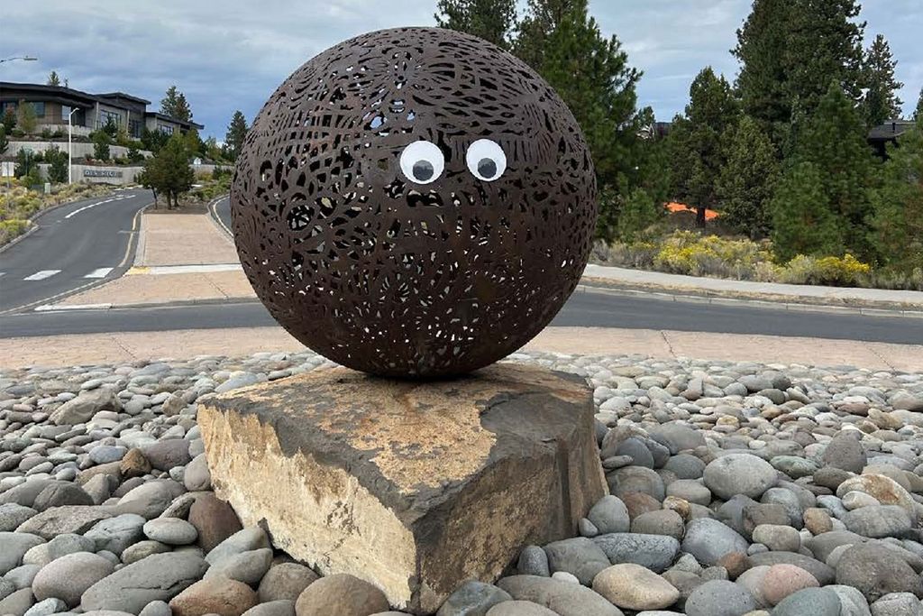 Round sculpture with googly eyes