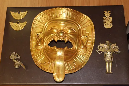 A gold Tumaco mask found among gold figurines and ancient jewelry recovered at Madrid's Barajas airport