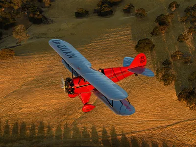 Waco vermillion with a gold-edged black stripe and silver wings: The airplane Chris Galloway flew in California last October wears the colors it did when Continental pilots flew it in Detroit in 1931.