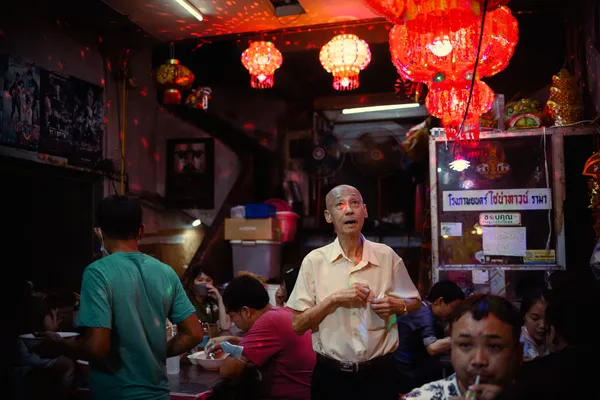 Man ejoing the decoration in a local restorant. thumbnail