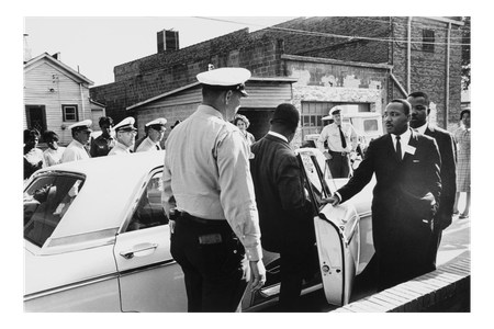 Martin Luther King Jr. and Reverend Ralph Abernathy are taken in for questioning by Birmingham police in 1962.