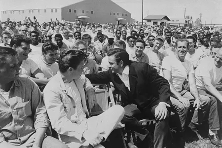 Johnny Cash chats with inmates and guests during his visit to Cummins Prison in Arkansas on April 10, 1969.