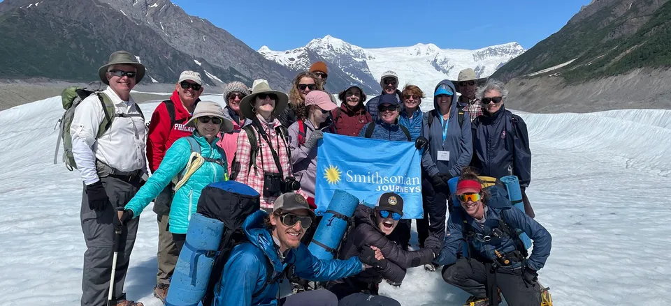 None Smithsonian Journeys travelers on a glacier in Alaska. Credit: John Grabowska 