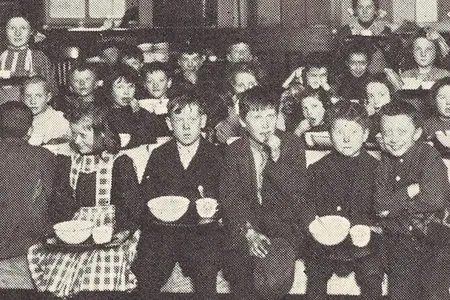 Philadelphia children eating a "three-cent dinner" at school, featured in the 1913 book School Feeding: Its History and Practice at Home and Abroad