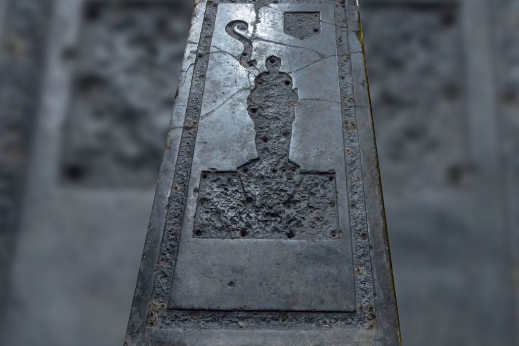 Black slab of stone with indentation