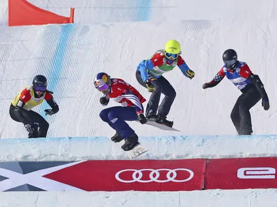 Four snowboarders compete in the Women&#39;s Snowboard Cross final during the FIS Ski Cross World Cup 2022, part of a 2022 Beijing Winter Olympic Games test event.&nbsp;