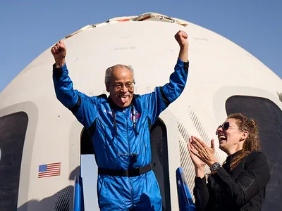 Ed Dwight celebrates after landing back on Earth following Sunday morning&#39;s ten-minute flight to space.