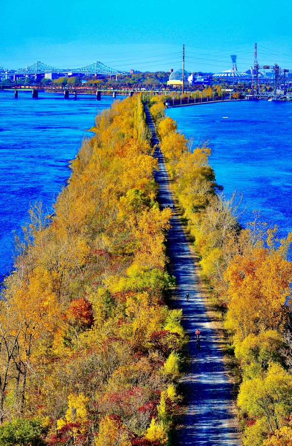 Autumn on a bicycle path running inside & along the Canadian St. Lawrence River thumbnail