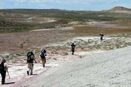 On the march back from the Death March site, everyone carries bags of sediment