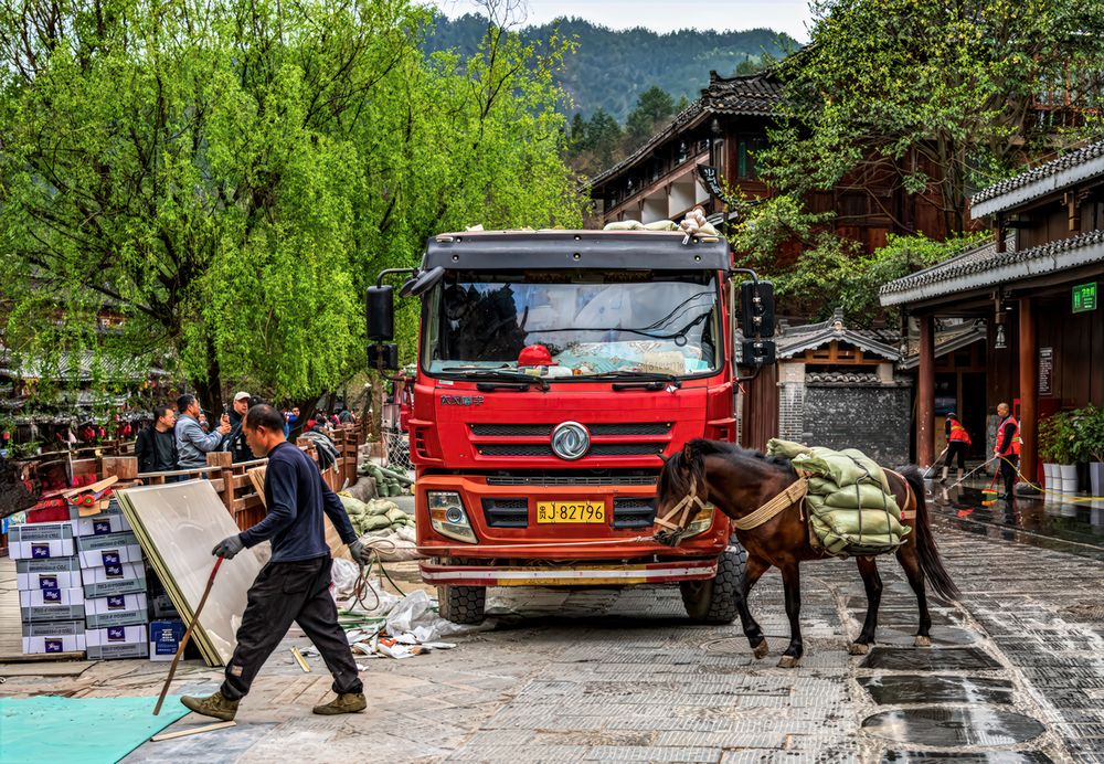 People transport construction materials using modern and original means of transport.
