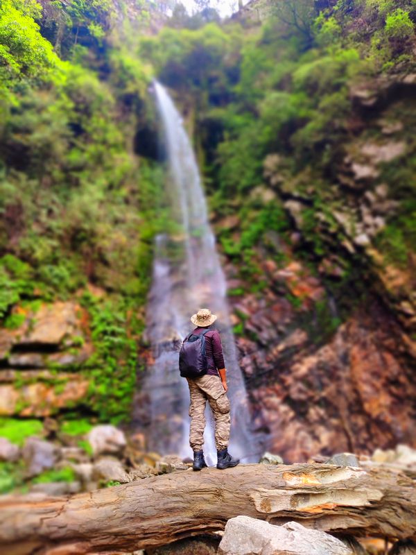 A adventure enthusiast searching for peace in waterfall thumbnail