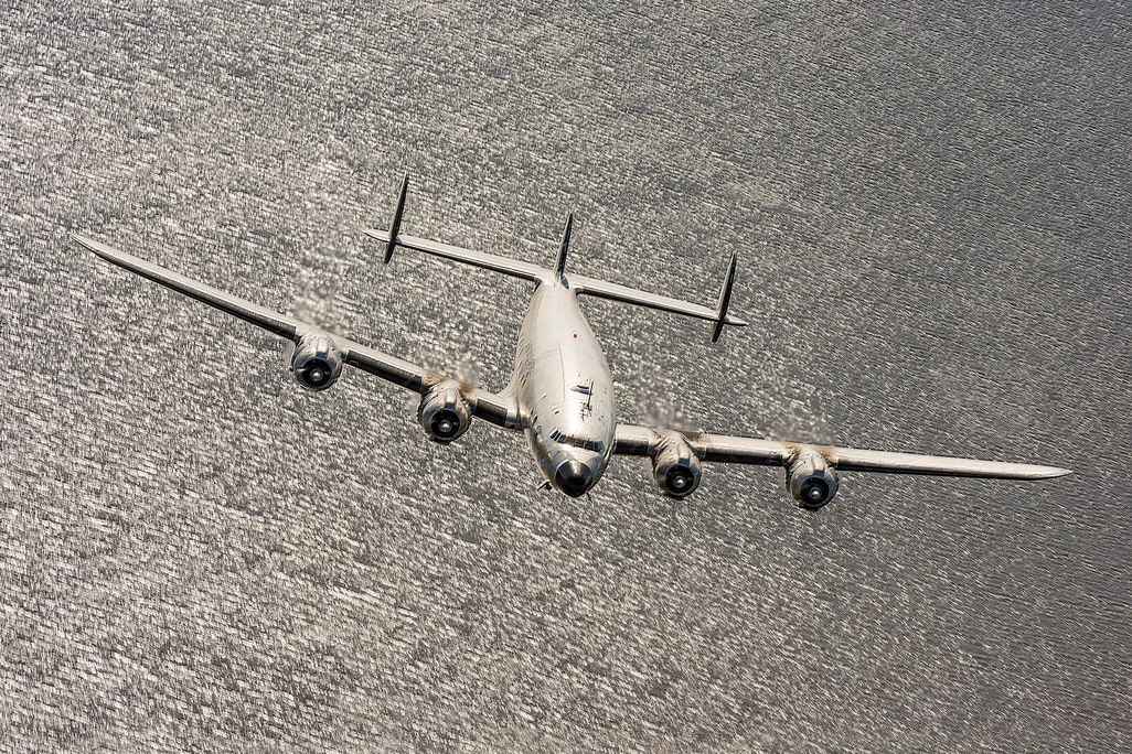 Lockheed Constellation over a lake in monochrome