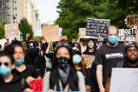 Protestors march through the streets of D.C. during demonstrations over the death of George Floyd, who died in police custody.