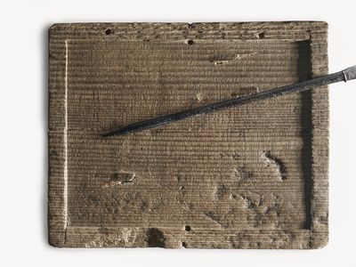 A wax writing tablet with a stylus