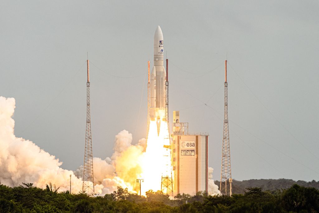 A rocket lifting off from Earth
