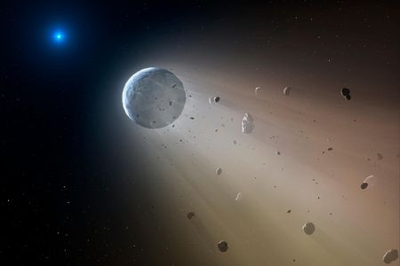 An artist’s rendering shows a white dwarf star shredding a rocky asteroid.