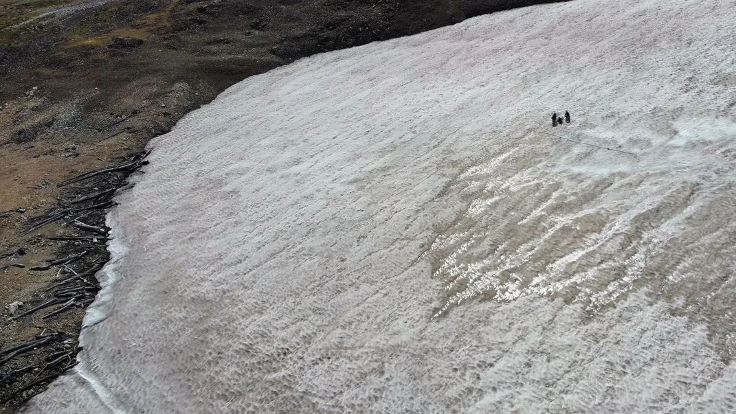 Large ice patch with individuals standing on it