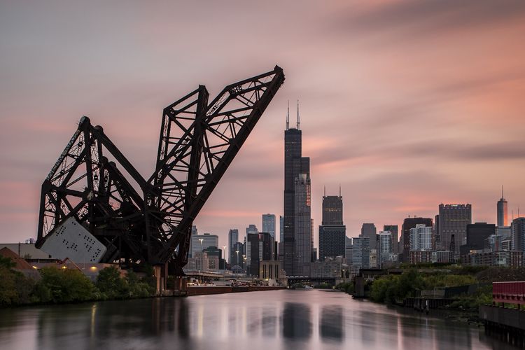 OPENER - Built in 1917-1919, the St. Charles Air Line Bridge is one of the oldest in Chicago and has been designated a city landmark. It’s still in use for freight and cargo trains, and it lifts for boats and ships passing underneath.